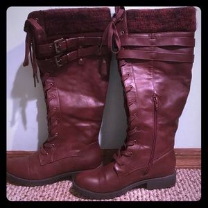 Knee high maroon leather lace up boots